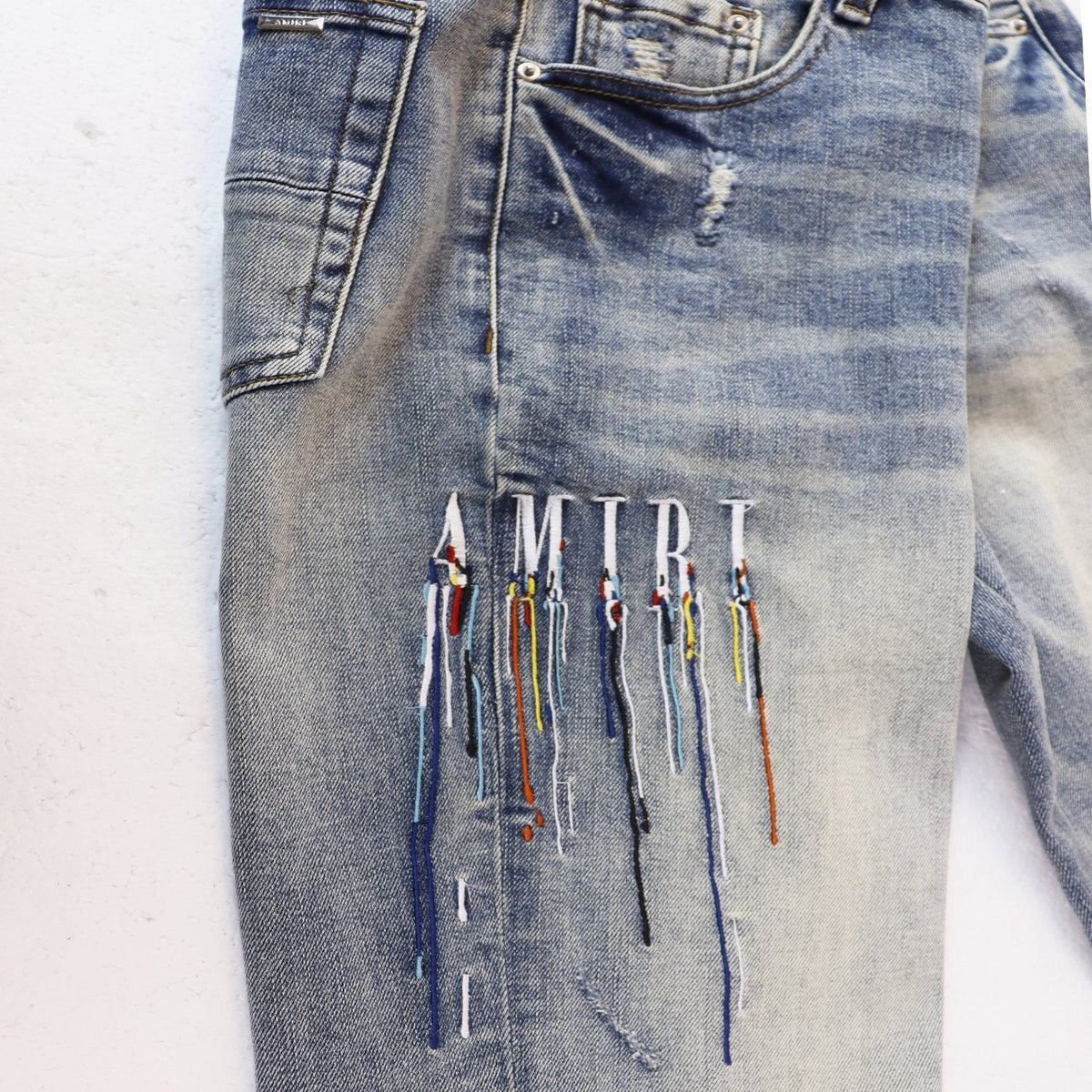 AMIRI Sinners Distressed Skinny Jeans — front